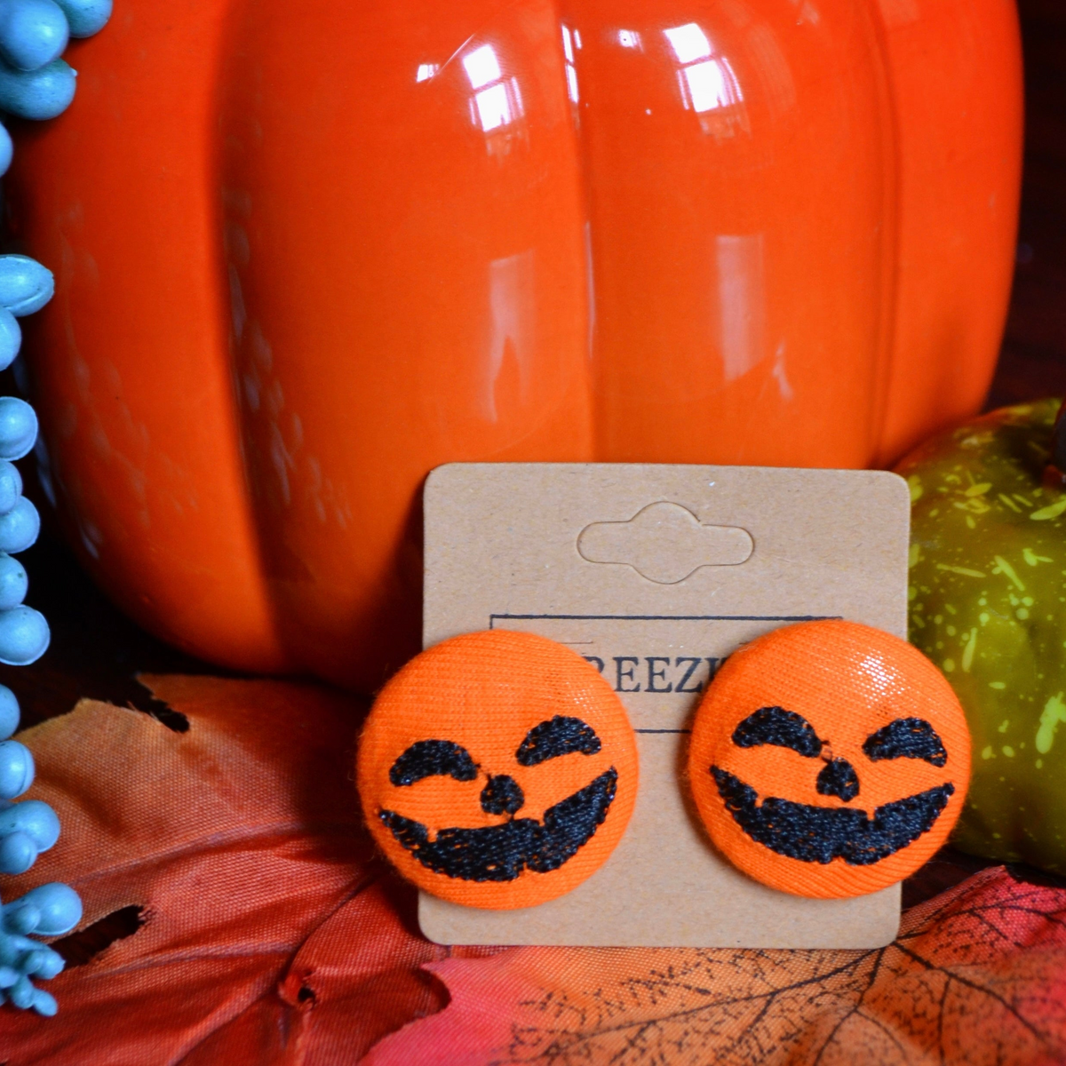 Happy jack-o'-lantern embroidered earrings, Halloween-themed earrings with playful pumpkin face design